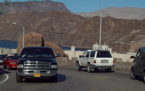 standing on the edge of the hoover dam