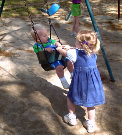 melanie pushes max in the swing